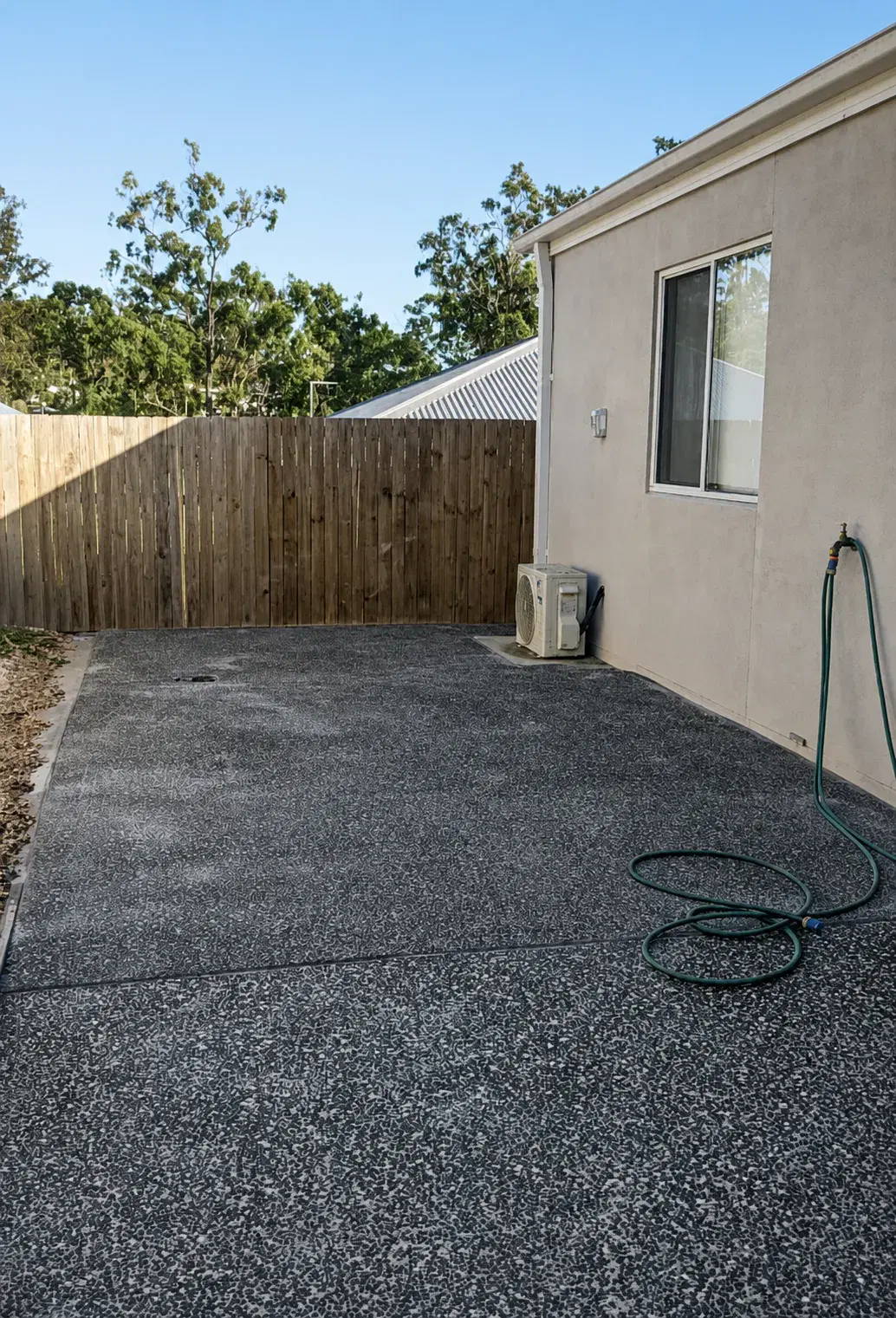 Finished exposed aggregate concrete beside Janet Furnish's home