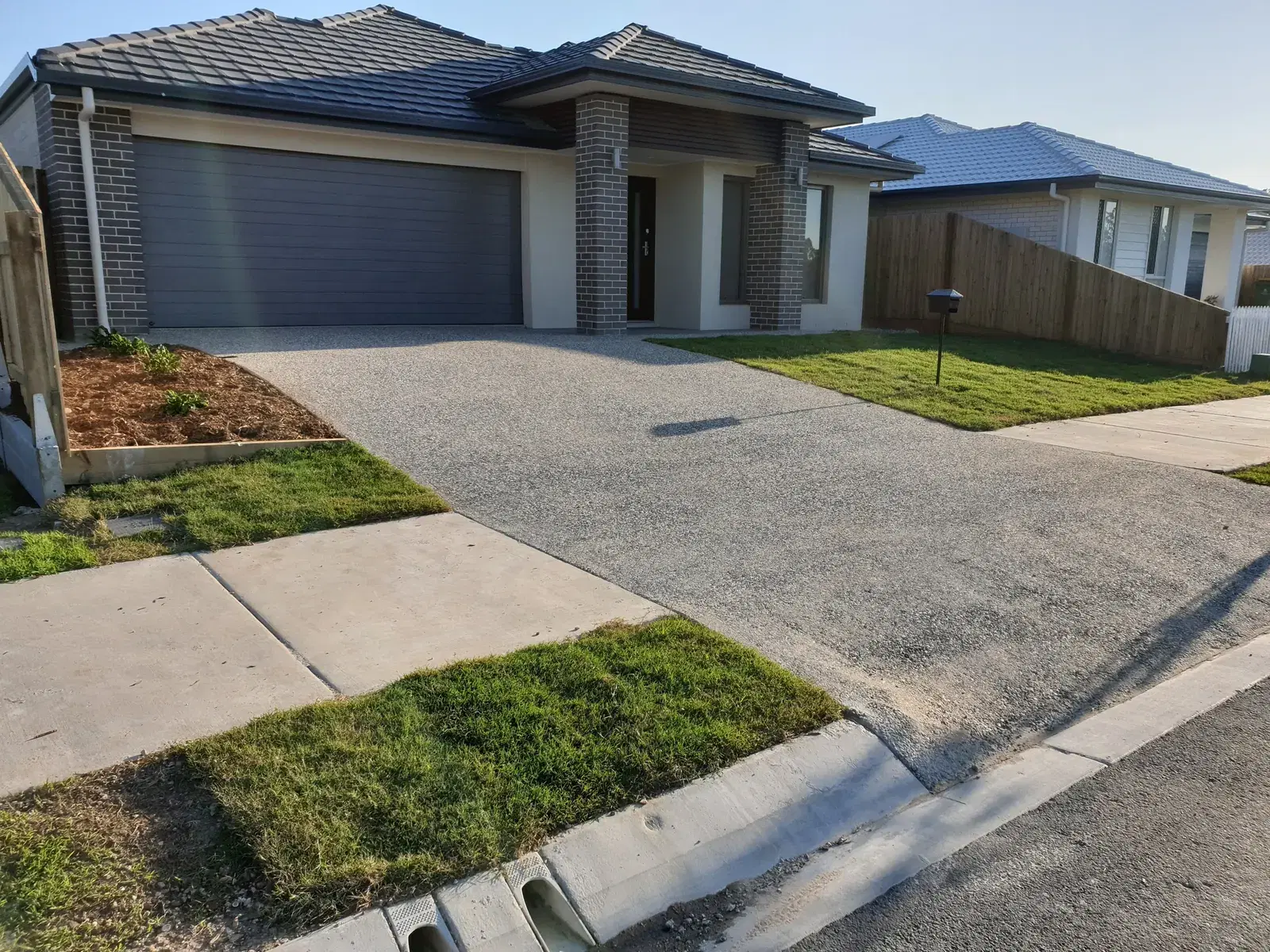 Exposed aggregate concrete driveway completed for a Springfield home